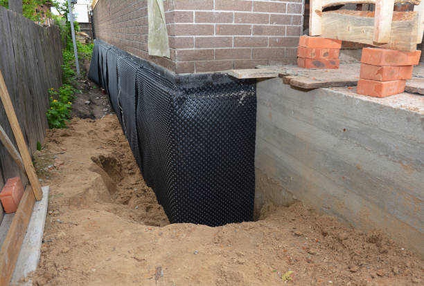 SJ Waterproofing Pros technician performing targeted Interior Drainage System assessment in Shepherd, MI